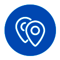 Dos iconos de chinchetas superpuestas dentro de una insignia circular azul con un borde blanco